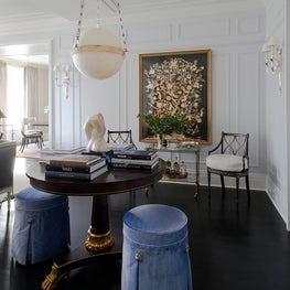 Gallery room with wainscoting, ball pendant