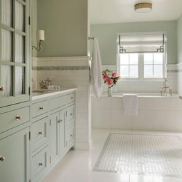 Sleek green and white modern farmhouse master bath