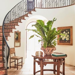 Malibu Spanish Colonial, Entry featuring spiral staircase and antique flooring