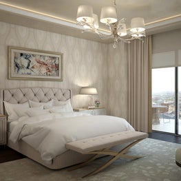 Neutral patterned wallcovering with a tufted headboard is a welcome comfort.