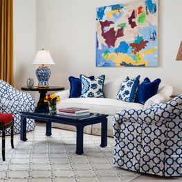 This bright sitting area is upholstered in bold and vibrant patterns.