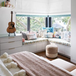 Layers of texture, color, and pattern create a cozy and inspiring retreat for the youngest member of the family.