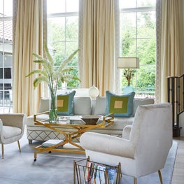 A seating area in a living room meant for conversation.