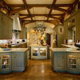 Here is a fully functional and inviting, yet elegant kitchen with significant architectural interest.  It is a warm blend of textures, enhanced by special, dramatic details, creating a spacious and user-friendly room.