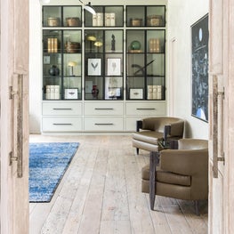 Timeless study with contemporary furniture & custom bookshelf; Houston, TX