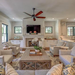 Coastal Living Room with neutral tones and pops of color in the artwork.