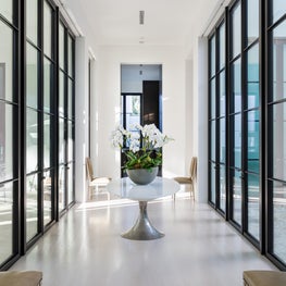 An axial gallery bordered by large steel doors