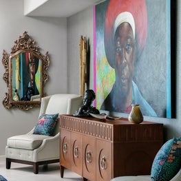 Detail shot of grasscloth covered wall and original artwork 