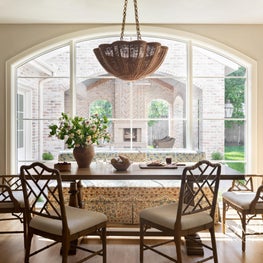In the breakfast nook, we installed a mammoth arched window that invites natural light to shine.