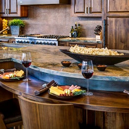 Multi-level countertops to expand prep zones and accommodate island seating