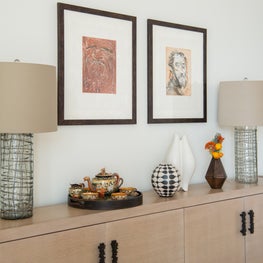 Portfolio: Collected and worldly interior featuring a chic console with dark hardware