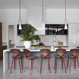 The transition from dining room to kitchen is seamless. Our team chose to make the flow of both dining room and kitchen open for easy entertaining