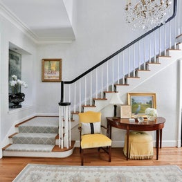 Traditional entry hall & stairway with a soft neutral & yellow palette