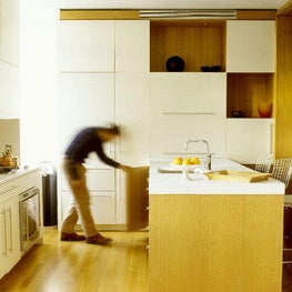 Downtown Kitchen with sleek white cabinets