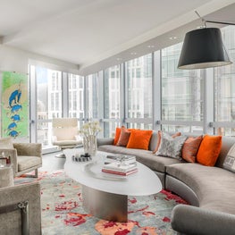 Custom curved sofa and cocktail table in living space 