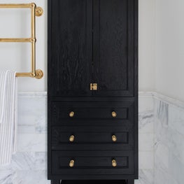 Custom Linen Closet in Flame-Blackened Oak with Brass