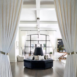 Portfolio: An entry way with custom velvet settee and drapery.