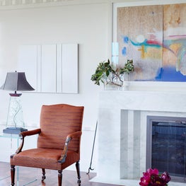 Marble fireplace detail & an English armchair upholstered in Jim Thompson fabric