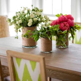 Dining Tabletop Vignette with Upholstered Dining Chairs and Florals