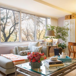Washington D.C. Great Room. Lavender walls with celadon and orange accents, open plan of chaises, klismos desk chair & lattice coffee table.