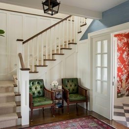 Entry hall with checkered floor and staircase