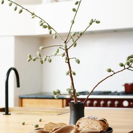 Soulful Home Kitchen Island with Kallista One Pull-down Kitchen Faucet