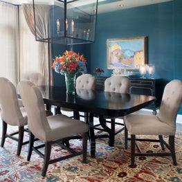 American Lodge Dining Room. Chic country dining room wrapped in teal grasscloth with a richly colored Bidjar, black table & large lantern pendant.