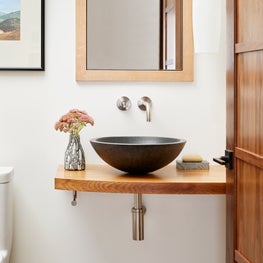 Soulful Home Powder Room with vessel sink and exposed plumbing