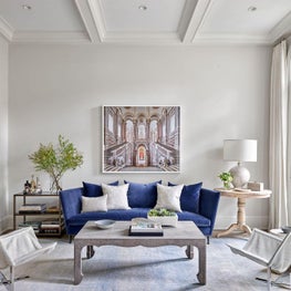 Living Room, Blue Montauk Sofa, David Burdeny Art, Ironies Design Coffee Table, Oscar Isberian Rug, Cream Walls, Cream Curtains - Lincoln Park Greystone Project