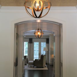 Foyer with custom wallpaper ceiling.