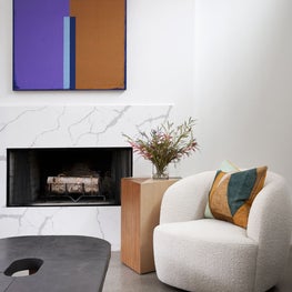 Portfolio: Contemporary sitting room with boucle chair and pops of color