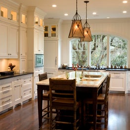 White Kitchen with Black Island and Segmental Arch Window