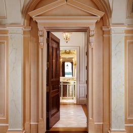 Pedimented entry to a Powder Room.  Burl walnut flooring and door.