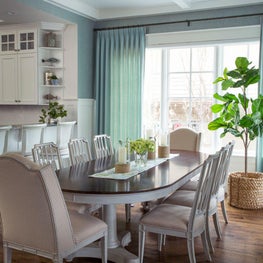 Breakfast room with floor-to-ceiling windows and coffered ceiling