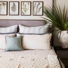 Organic motifs and textures make this neutral bedroom so inviting