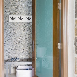 Portfolio: Pool bath in contemporary-style home featuring pebbled walls and TruStile door