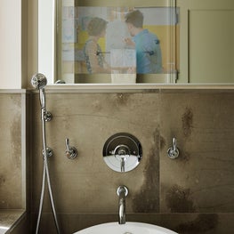 Bathroom with digital screen in mirror