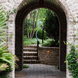 Brick Arched Exterior Breezeway and Landscape Brick Steps