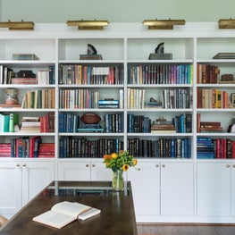 Portfolio: A thoughtful book arrangement contrasts boldly against white shelves.