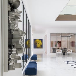 Portfolio: The contemporary Friar Tuck residence featuring abstract art and velvet benches.