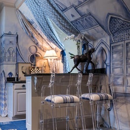 Designer House - Bar featuring hand-painted wall covering and over-dyed rugs