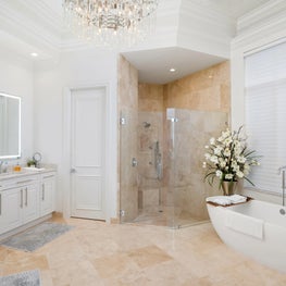 Expansive Decadent Waterfront - bathtub, shower, white cabinets, lighted mirror
