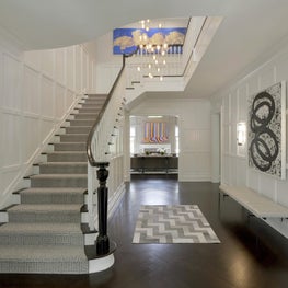 Stair hall with paneled walls