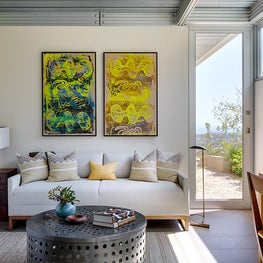 Den with a diptych and desk