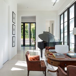 Expansive steel doors in a modern music room