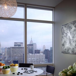 Breakfast room in NYC apartment, city view, pendant lighting