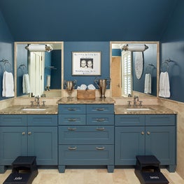 Boys Bathroom with  Blue Double Vanity and Stone Counter Tops
