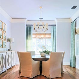 Natural linen, reclaimed wood floors and a breezy palette bring the outside in.