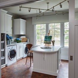 Lake Geneva Art & Laundry Studio. Waxed mesquite floor with walnut Cherner stool.