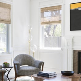 Eclectic living room with vintage lounge chairs and modern coffee table.